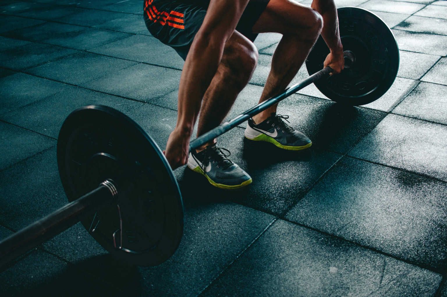 Biohack Insider image of someone lifting weights for the article "Are nootropics good for pre-worked?"