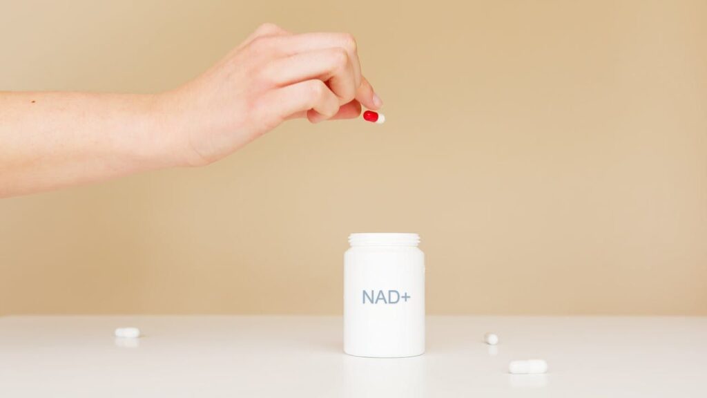 An image of a NAD+ pill bottle, part of the article "Do NAD+ Supplements Actually Work?" on Biohack insider.