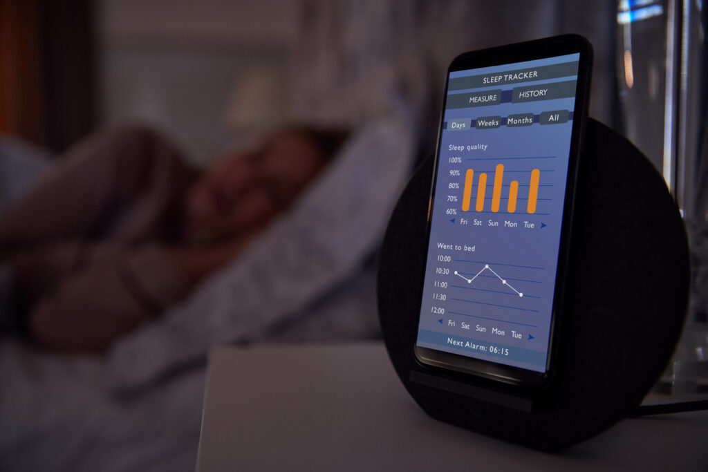 Image of a sleep tracker, one of the ways you can improve your REM sleep.